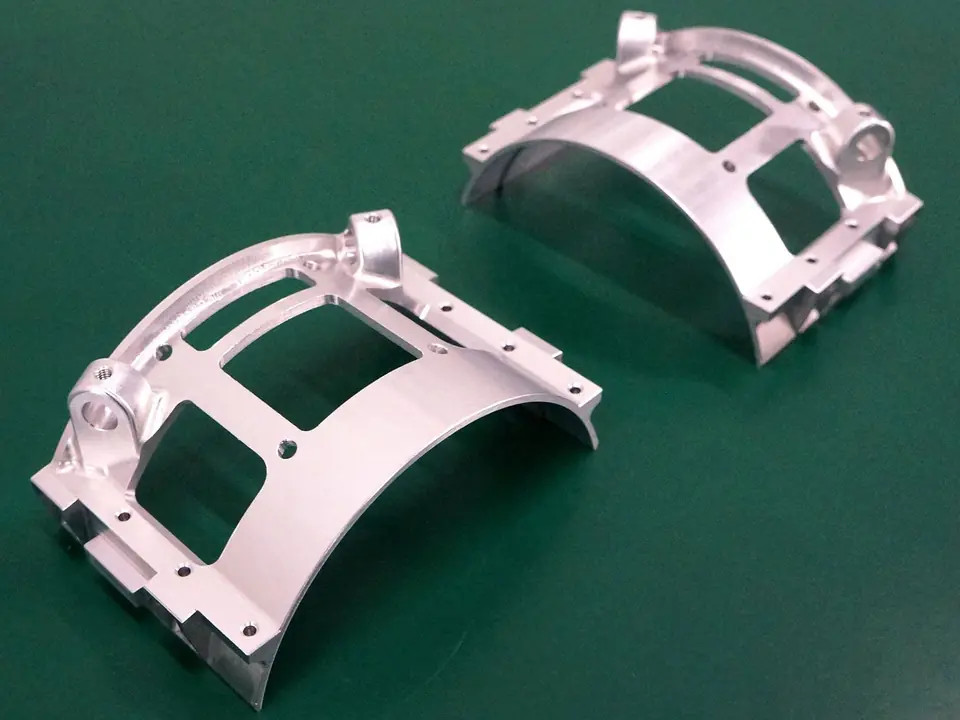 Matched pair of aluminium brackets, 4-axis milled