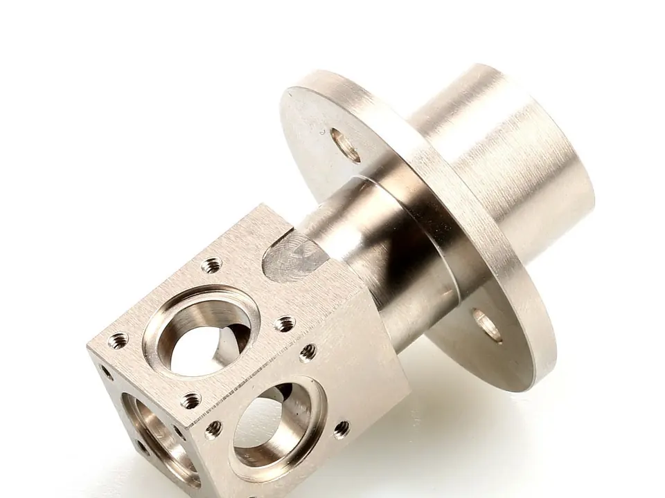 Aluminum block with flange, turned and cross-drilled