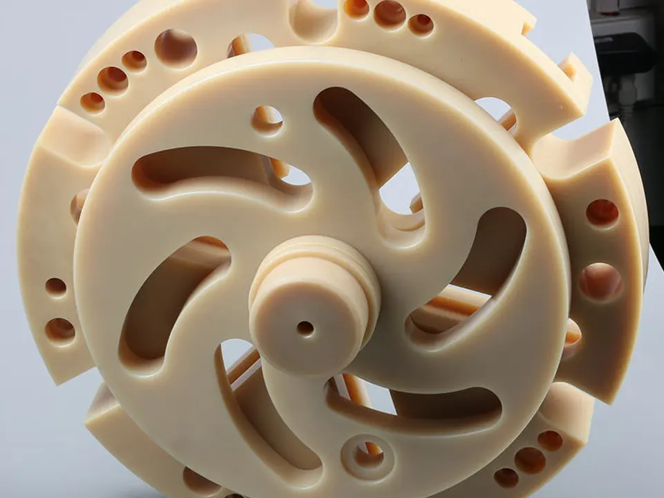 Engineering plastic rotor with curved cut-outs