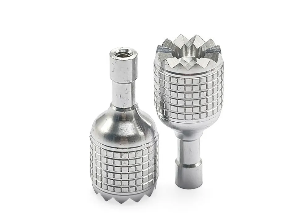 Two knurled aluminium fittings with serrated ends, turned